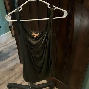 Dressy tank top with glittery and abstract neckline.